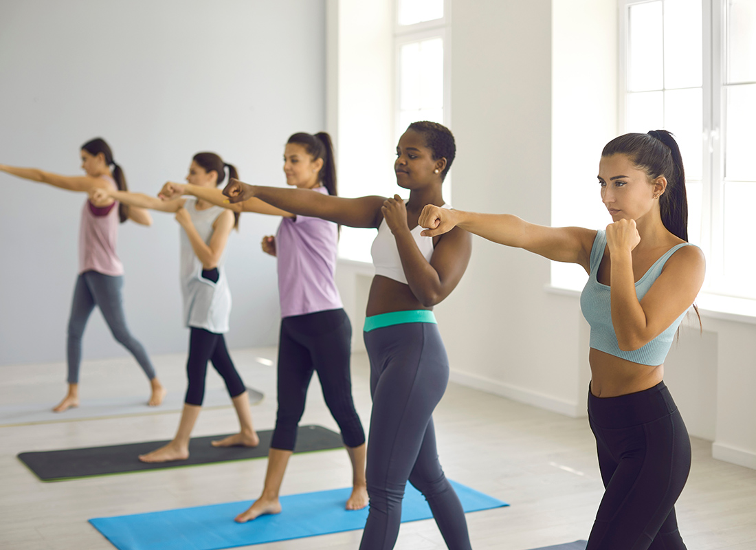 Employee Benefits - Group of Woman Exercising in a Class